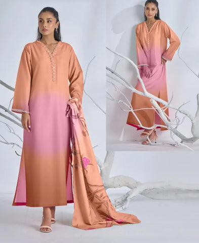 Woman wearing a pink and orange gradient outfit with a matching dupatta, standing against a white background.